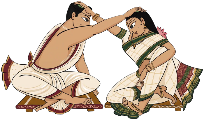 Bride and groom placing jeelakarra bellam on each other’s heads