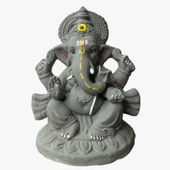 Hand-shaped 9 inch river clay Ganesha idol, front view, trunk turned to the left