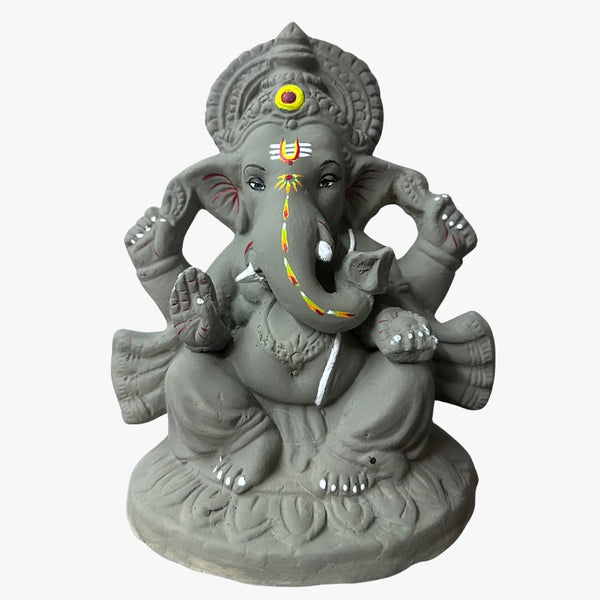 Hand-shaped 9 inch river clay Ganesha idol, front view, trunk turned to the left