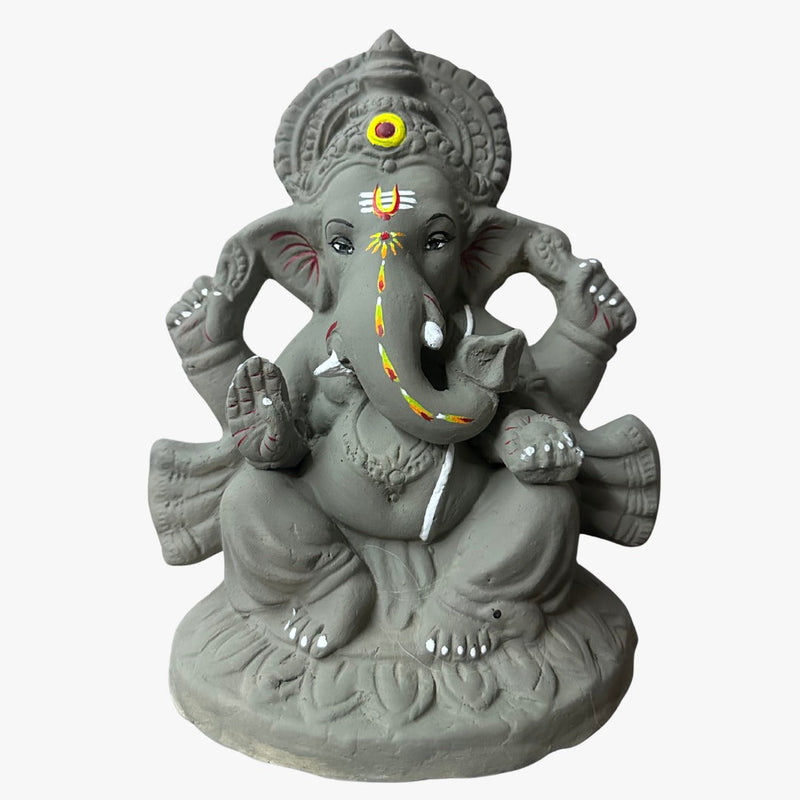 Hand-shaped 9 inch river clay Ganesha idol, front view, trunk turned to the left